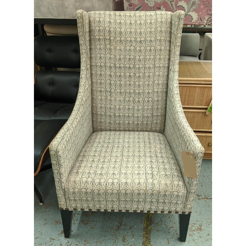 534 - ANDREW MARTIN LIBRARY CHAIR, 70cm x 116cm H, in a patterned linen fabric with studded detail.