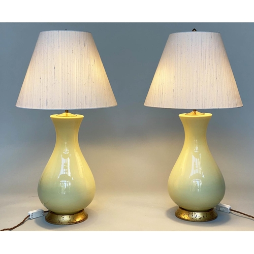 87 - LOUISA TABLE LAMPS, a pair, 78cm H, by Heathfield and Co., lemon yellow ceramic, vase form with gild... 