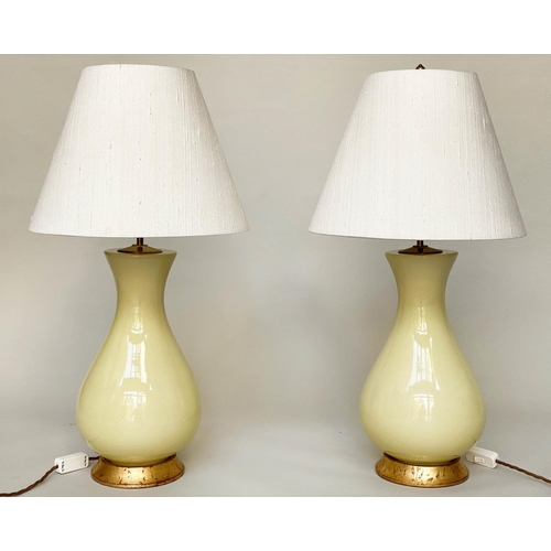 87 - LOUISA TABLE LAMPS, a pair, 78cm H, by Heathfield and Co., lemon yellow ceramic, vase form with gild... 