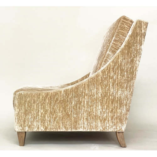 96 - ARMCHAIR, winged with sloping arms in neutral textured chenille velvet, 66cm W.