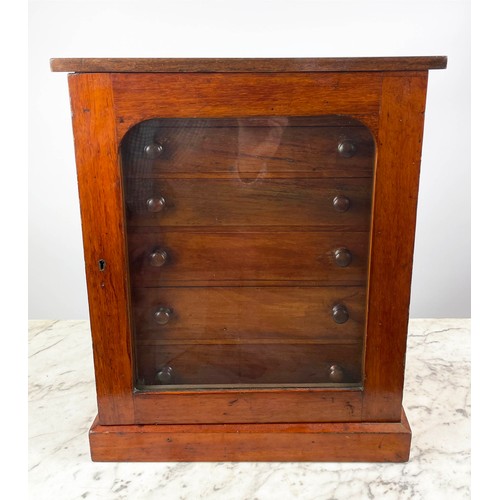 16 - COLLECTORS CABINET, Victorian mahogany with six graduated drawers behind arched glazed door on plint... 