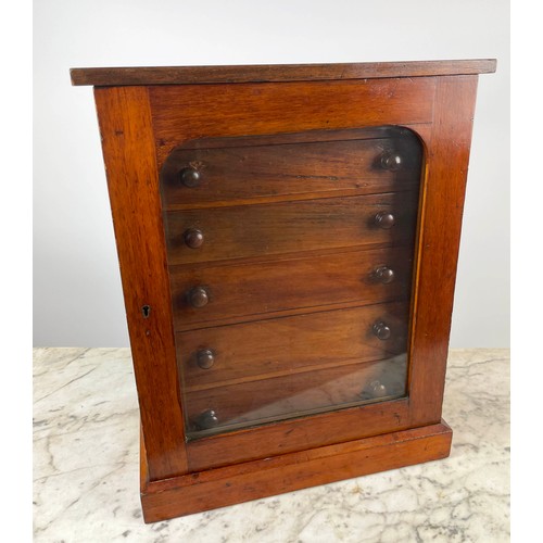 16 - COLLECTORS CABINET, Victorian mahogany with six graduated drawers behind arched glazed door on plint... 