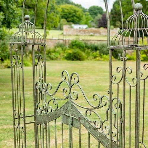 372 - ARCHITECTURAL GARDEN GATE, 250cm high, 185cm wide, 38cm deep, Regency style, aged painted finish.