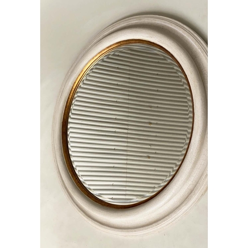 118 - WALL MIRROR, circular beveled within a deep grey frame with gilt slip, 91cm W.