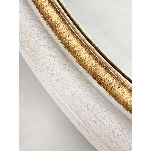 118 - WALL MIRROR, circular beveled within a deep grey frame with gilt slip, 91cm W.