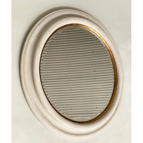 118 - WALL MIRROR, circular beveled within a deep grey frame with gilt slip, 91cm W.