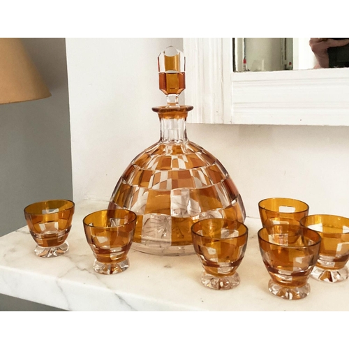 127 - DECANTER AND GLASSES, Art Deco Bohemian decanter and six glasses with amber overlaid glass detail de... 