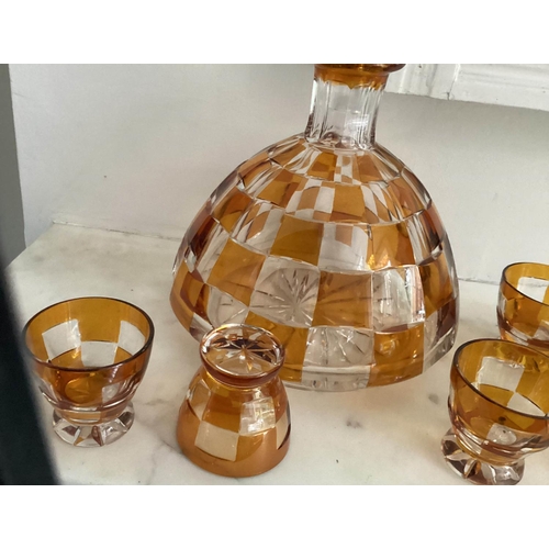 127 - DECANTER AND GLASSES, Art Deco Bohemian decanter and six glasses with amber overlaid glass detail de... 