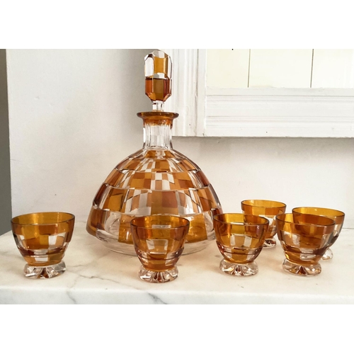 127 - DECANTER AND GLASSES, Art Deco Bohemian decanter and six glasses with amber overlaid glass detail de... 