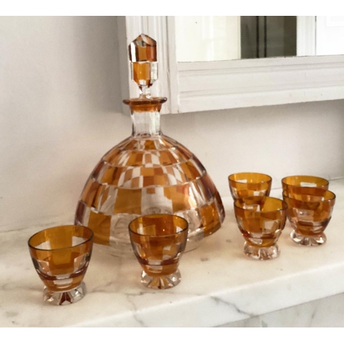 127 - DECANTER AND GLASSES, Art Deco Bohemian decanter and six glasses with amber overlaid glass detail de... 