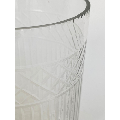 134 - STORM LANTERNS, a pair, cylindrical cut and engraved glass on stepped plinth bases, 40cm H. (2)