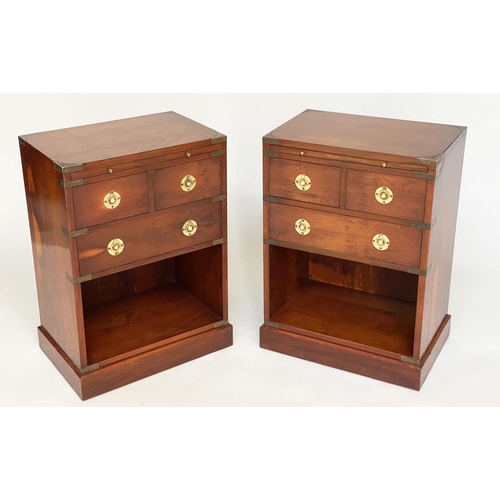 135 - CAMPAIGN STYLE CHESTS, a pair, yewwood and brass bound each with tooled leather brushing slide and t... 