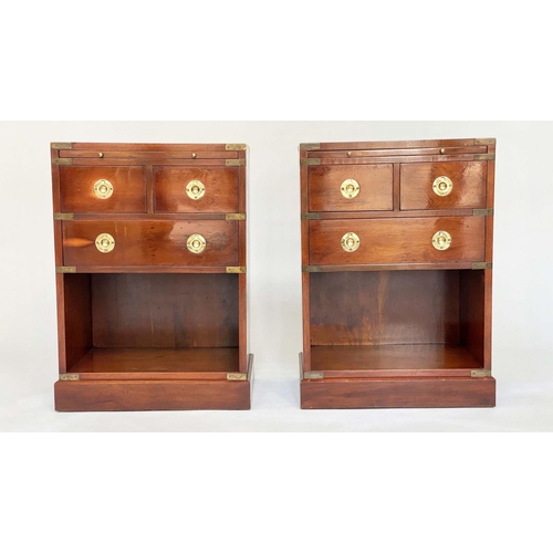 135 - CAMPAIGN STYLE CHESTS, a pair, yewwood and brass bound each with tooled leather brushing slide and t... 