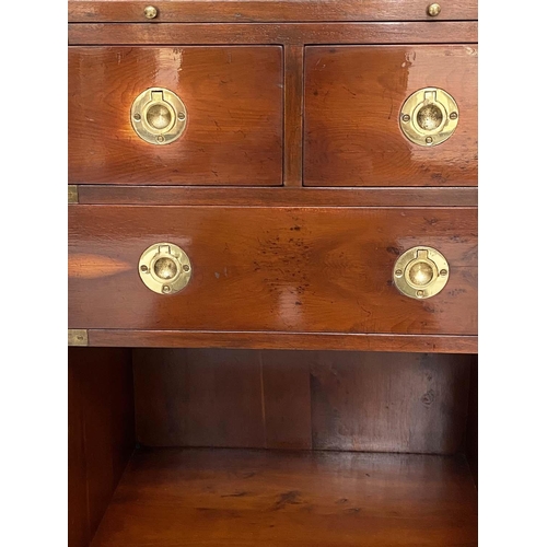 135 - CAMPAIGN STYLE CHESTS, a pair, yewwood and brass bound each with tooled leather brushing slide and t... 