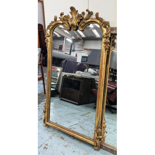 143 - WALL MIRROR, 85cm W x 156cm H, with a decorative surmount, 19th century French giltwood and gesso.