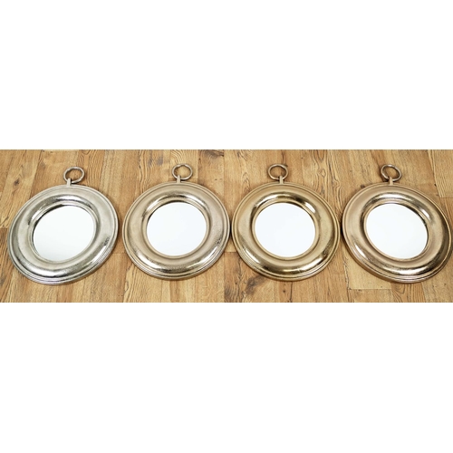 408 - WALL MIRRORS, a set of four, each with differing colour metal frames, ring detail, 34cm x 44cm. (4)