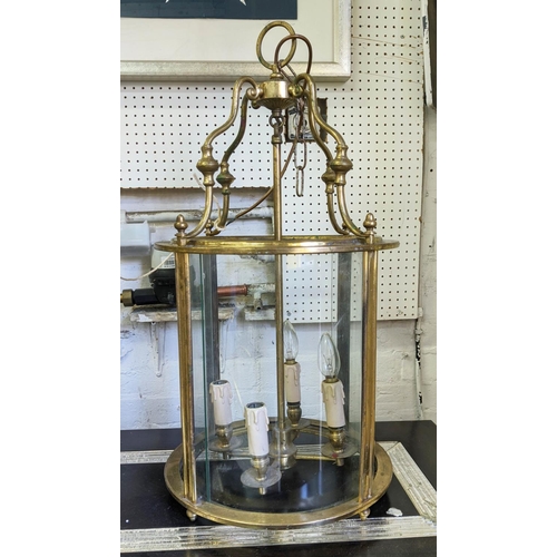 371 - HALL LANTERN, 71cm high, 37cm diameter, gilt metal and curved glass.