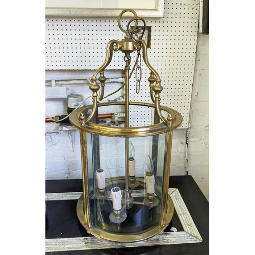 371 - HALL LANTERN, 71cm high, 37cm diameter, gilt metal and curved glass.