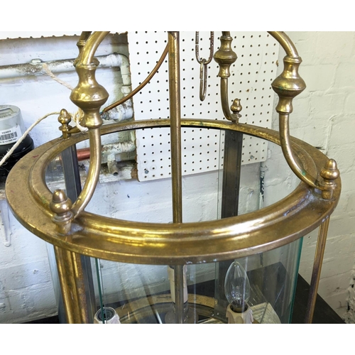 371 - HALL LANTERN, 71cm high, 37cm diameter, gilt metal and curved glass.