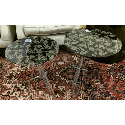 432 - NEST OF TABLES, a set of two, 50cm x 53cm H at largest, floral and foliate print glass tops, perspex... 