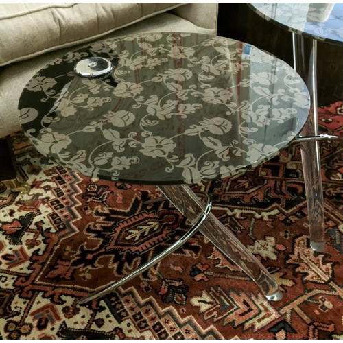 432 - NEST OF TABLES, a set of two, 50cm x 53cm H at largest, floral and foliate print glass tops, perspex... 