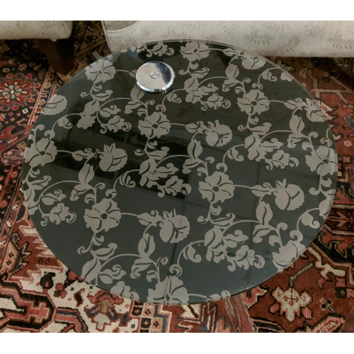 432 - NEST OF TABLES, a set of two, 50cm x 53cm H at largest, floral and foliate print glass tops, perspex... 