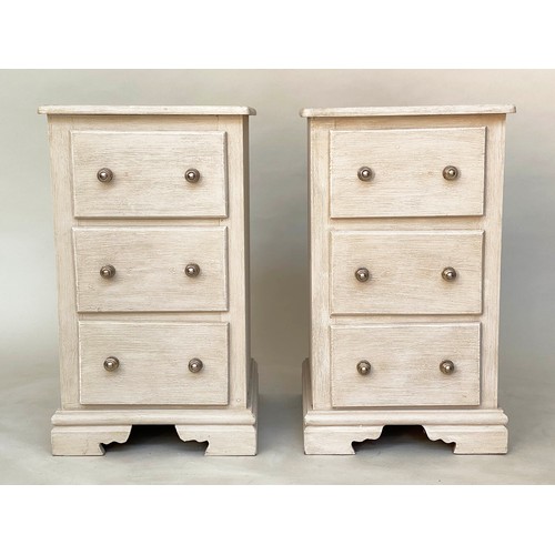 117 - BEDSIDE CHESTS, a pair, traditionally grey painted each with three drawers and bracket supports, 46c... 