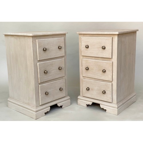 117 - BEDSIDE CHESTS, a pair, traditionally grey painted each with three drawers and bracket supports, 46c... 