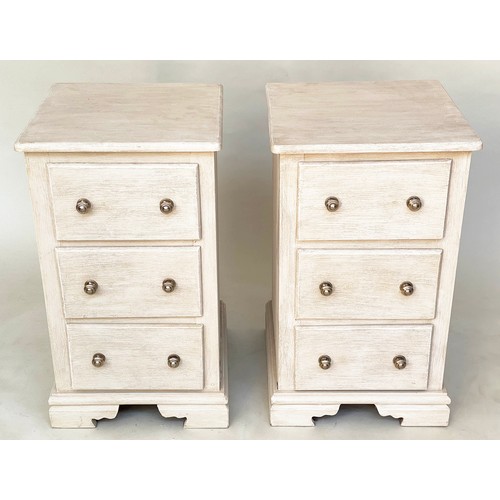 117 - BEDSIDE CHESTS, a pair, traditionally grey painted each with three drawers and bracket supports, 46c... 