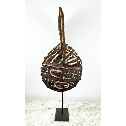 13 - A ZAMBIAN MAKISHI CEREMONIAL MASK, made from wicker and bark cloth with black bees wax and natural d... 