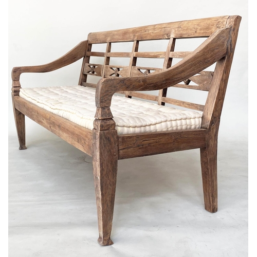 133 - BENCH, antique Anglo Colonial style teak with lattice back, down swept arms and later buttoned cushi... 