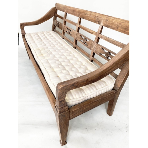 133 - BENCH, antique Anglo Colonial style teak with lattice back, down swept arms and later buttoned cushi... 