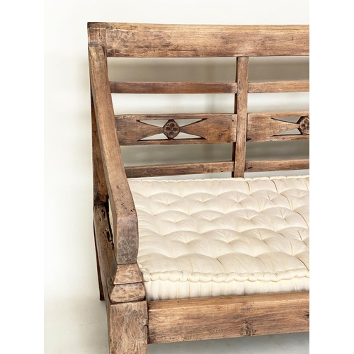 133 - BENCH, antique Anglo Colonial style teak with lattice back, down swept arms and later buttoned cushi... 