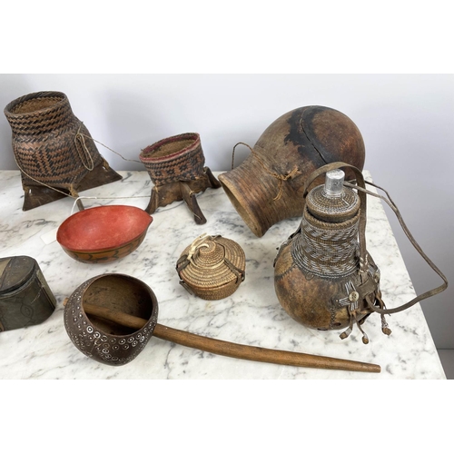 15 - A COLLECTION OF EAST AFRICAN AND TRIBAL ITEMS, a handmade coconut shell ladle, Ethiopian woven fiber... 