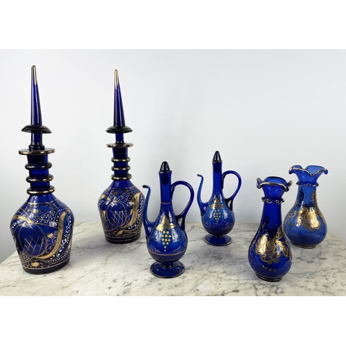 3 - BOHEMIAN DECANTERS, a pair, blue glass with gilt decoration and stoppers, two shaped lipped vases wi... 