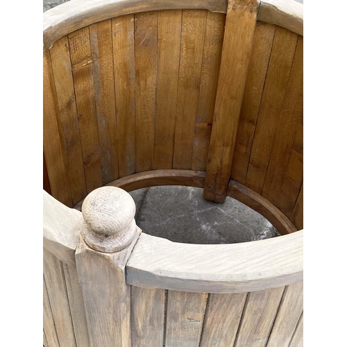 155 - GARDEN PLANTER, 76cm W x 74cm H, weathered oak, cylindrical form, in tongue and groove construction.