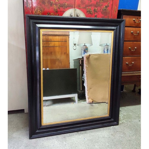 460 - WALL MIRROR, 115cm x 140cm, black frame with gilt detail beveled plate.