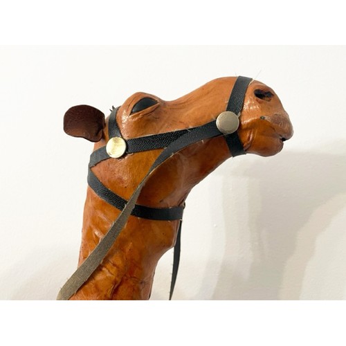 373 - CAMEL, 60cm H, vintage leather figure of a saddled camel.