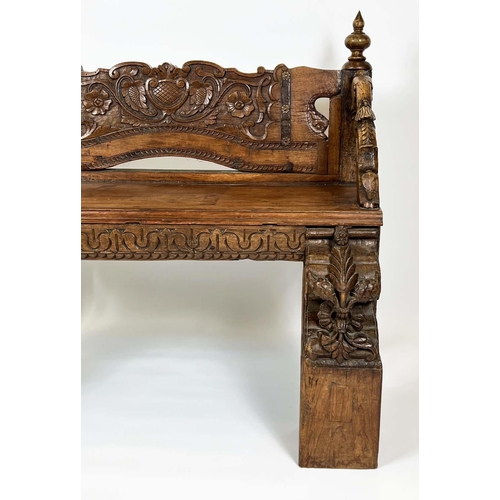 162 - RAJASTHANI BENCH, antique Indian hardwood, profusely carved with elephant head detail arms, 100cm H ... 