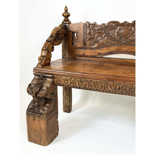 162 - RAJASTHANI BENCH, antique Indian hardwood, profusely carved with elephant head detail arms, 100cm H ... 