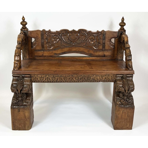 162 - RAJASTHANI BENCH, antique Indian hardwood, profusely carved with elephant head detail arms, 100cm H ... 