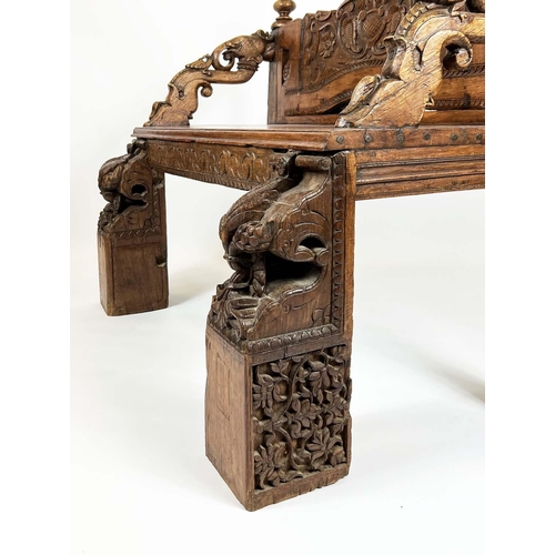 162 - RAJASTHANI BENCH, antique Indian hardwood, profusely carved with elephant head detail arms, 100cm H ... 