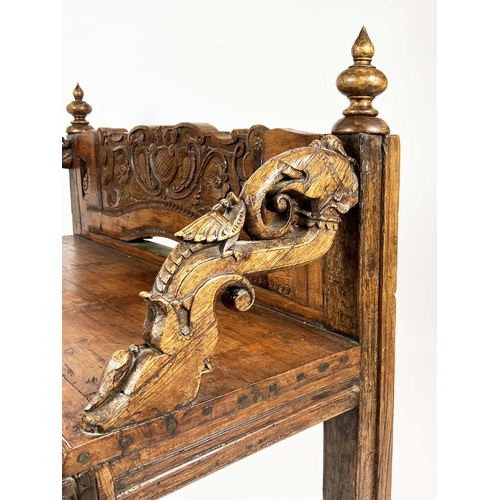 162 - RAJASTHANI BENCH, antique Indian hardwood, profusely carved with elephant head detail arms, 100cm H ... 