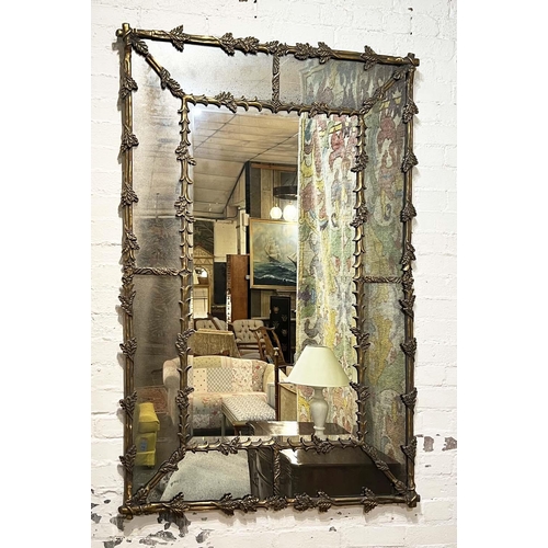 166 - WALL MIRROR, French style oak leaf decorated gilt frame with aged marginal plates, 154cm x 104cm.