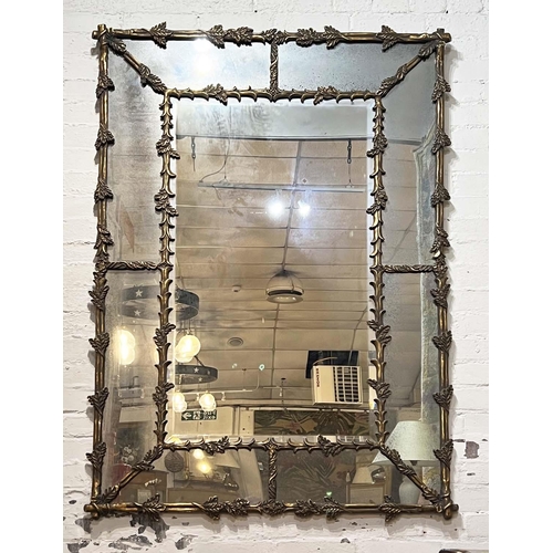 166 - WALL MIRROR, French style oak leaf decorated gilt frame with aged marginal plates, 154cm x 104cm.