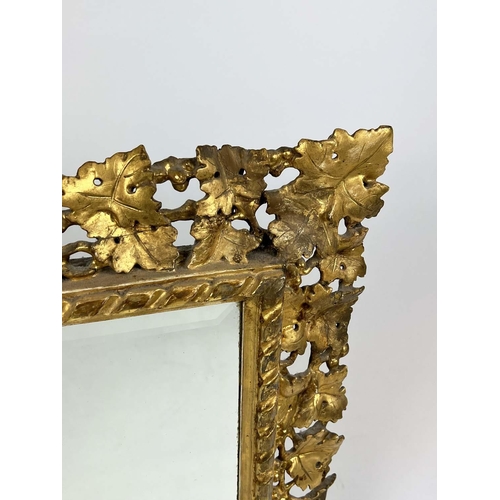 168 - WALL MIRROR, 19th century Florentine giltwood vine leaf design frame with a rectangular bevelled pla... 