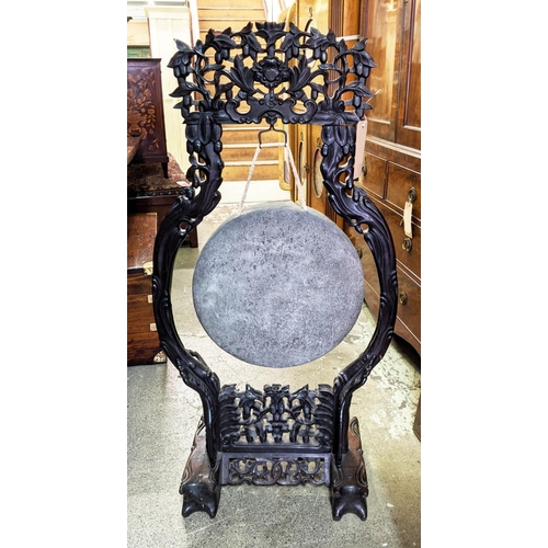 228 - CHINESE DINNER GONG, 65cm W x 127cm H 19th century ornately carved padoukwood with beater.