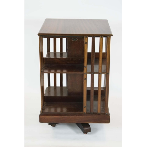 286 - MAPLE & CO REVOLVING BOOKCASE, 80cm H x 49cm W, Edwardian mahogany on ceramic castors, labelled.