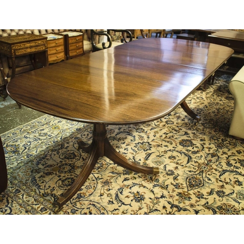 290 - TWIN PEDESTAL DINING TABLE, Regency mahogany with two leaves and brass castors, 73cm H x 107cm W x 1... 