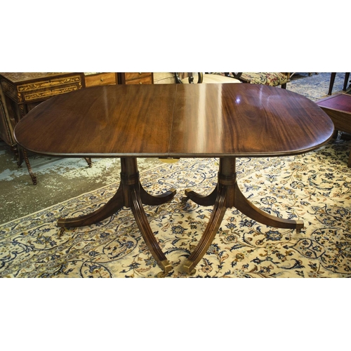 290 - TWIN PEDESTAL DINING TABLE, Regency mahogany with two leaves and brass castors, 73cm H x 107cm W x 1... 